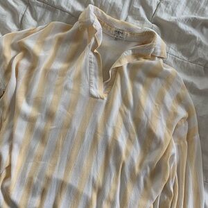 Yellow and white striped beachy shirt with open neck. Coastal!
